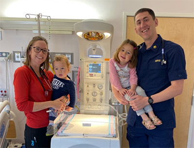 Aimee Stone, RN, MPH, IBCLC and Myles Stone, MD, MPH with their family