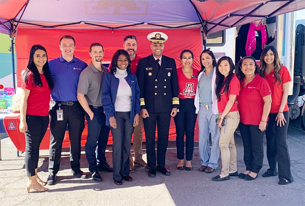 Surgeon General Dr. Jerome J. Adams with the MHU team, 2019